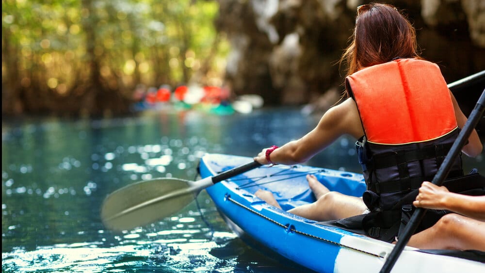 A photo of a group kayaking in Naples.