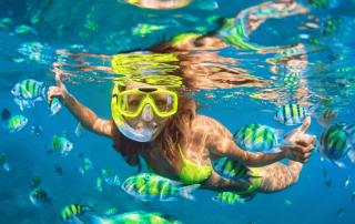 A photo of a woman snorkeling in Naples Florida.