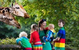 A photo of a family at the zoo, one of the many fun Naples kids activities.