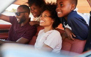 A photo of a family on a car ride from Fort Myers to Naples.