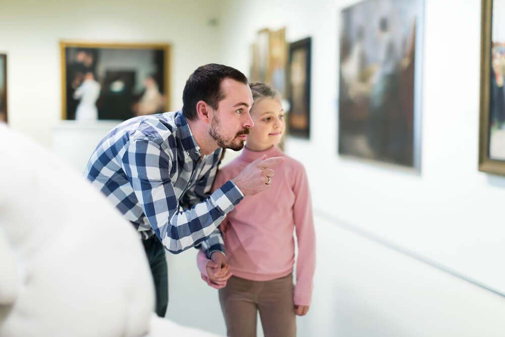 A father and daughter exploring one of the numerous museums in Naples, FL.