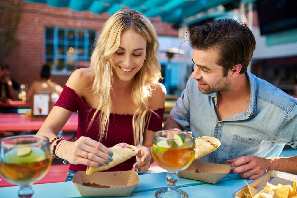 A couple eating at one of the best Mexican restaurants in Naples, FL.