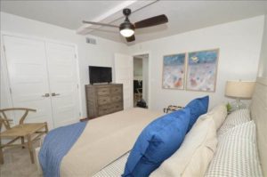 The bedroom of a Naples rental to relax in after searching for manatee.
