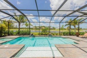 The pool of a Naples, FL, vacation rental to relax by while eating a treat from a bakery.