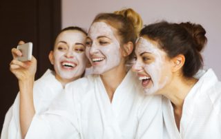 A group of women taking photos while at a Naples spa.