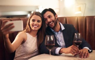 A couple talking a picture at a fine dining restaurant in Naples, Florida.