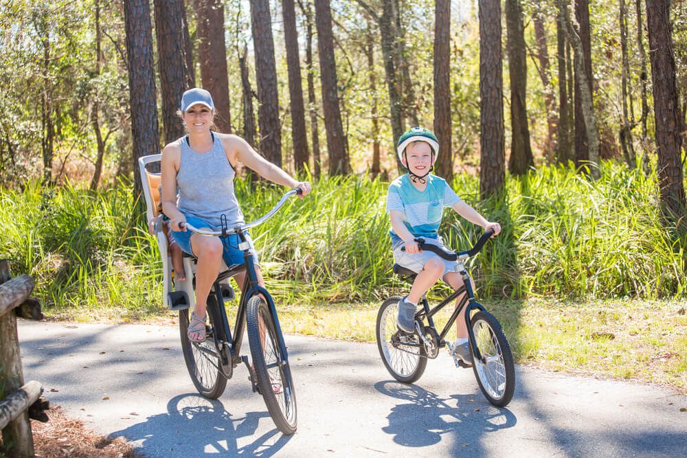 A family exploring Naples, Florida, on rental bikes.