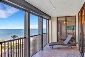 A balcony at a Naples rental overlooking one of the town's beaches.
