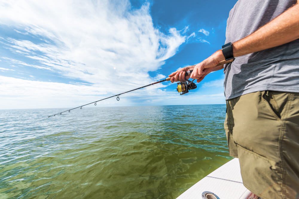 A person fishing on a trip in Naples, FL.